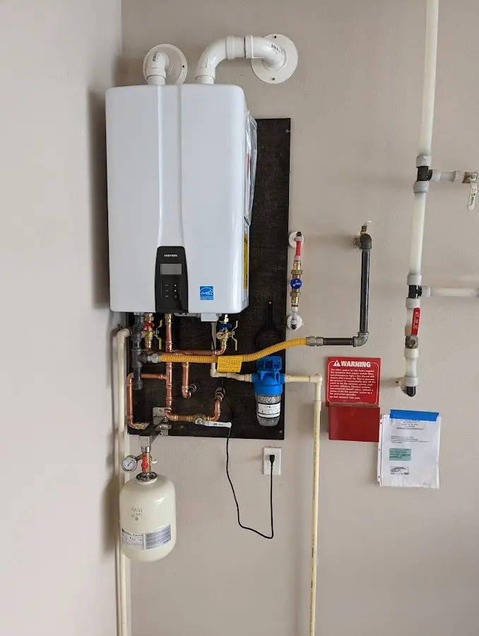 Professional plumber installing copper piping in a Suncoast Estates home